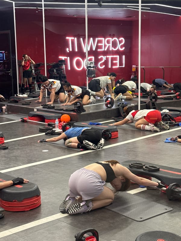 Indoor fitness class in session at Nong Pa Khrang gym