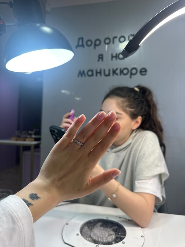 Woman gets manicure in early morning Yerevan salon