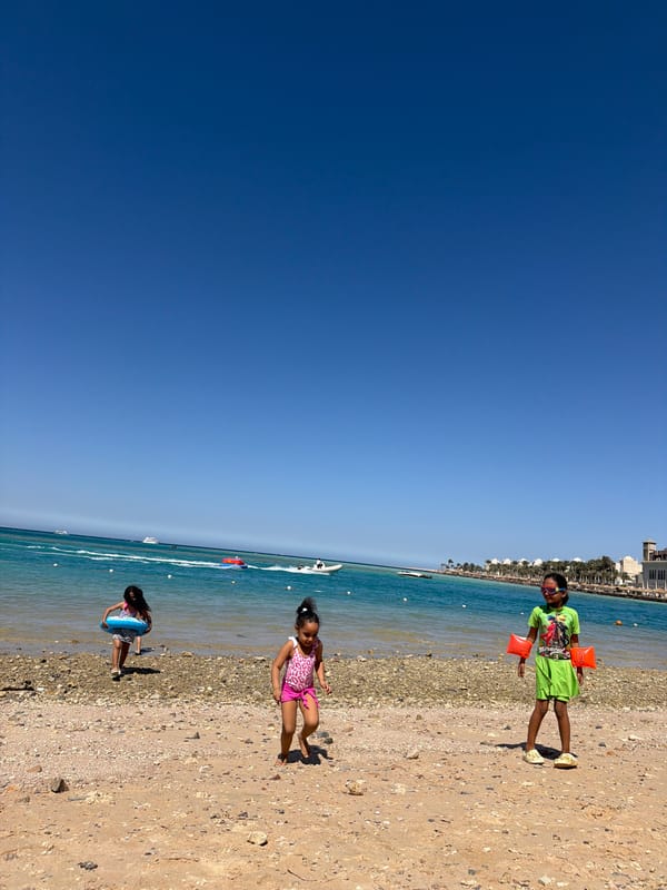 Children enjoy sunny beach day in Hurghada, Egypt