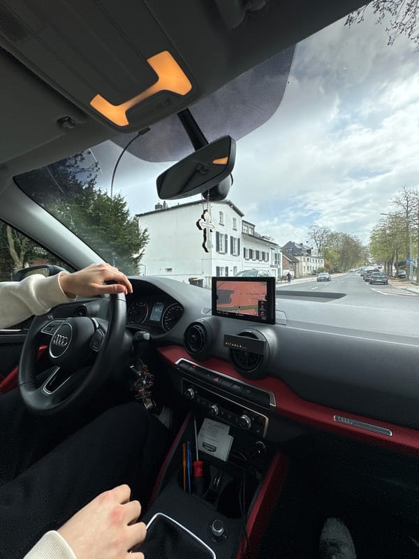 Driver navigates Mönchengladbach streets with GPS guidance