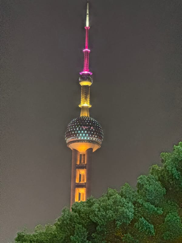 Shanghai nightlife captured around illuminated Oriental Pearl Tower