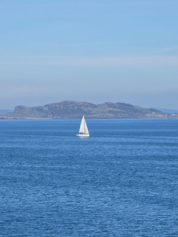 Sailboat spotted on calm waters off Randaberg, Norway coast