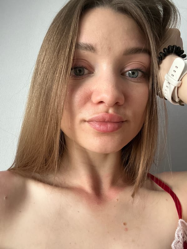 Woman photographs herself with blooming peonies in Kazan