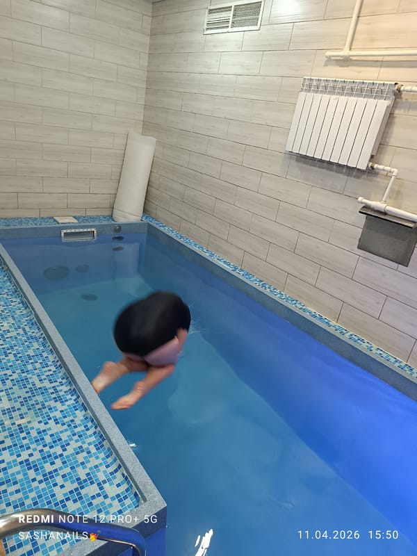 Indoor pool activities and outdoor food preparation in Chaikovsky
