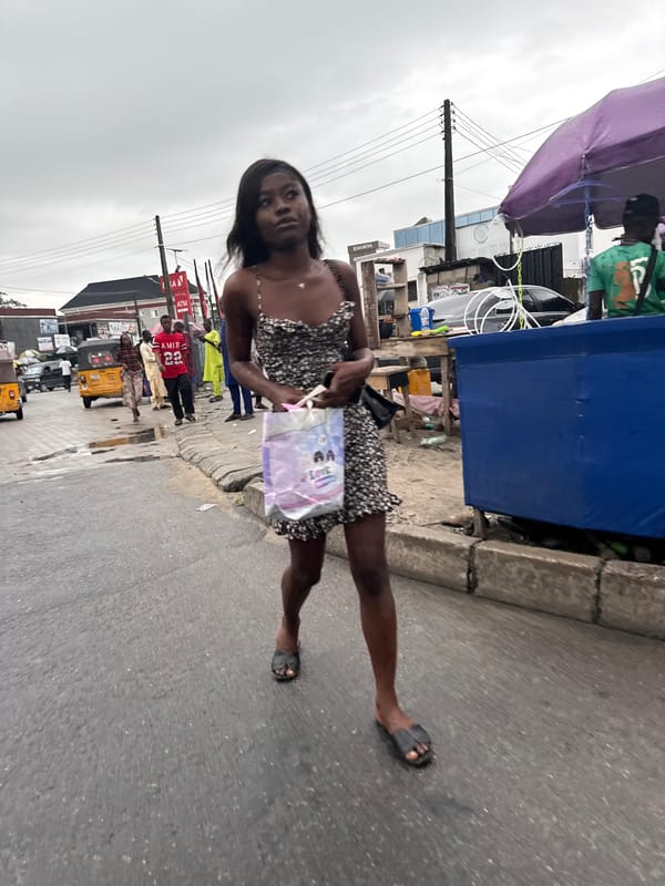 Everyday street life captured in Ado, Nigeria under overcast skies