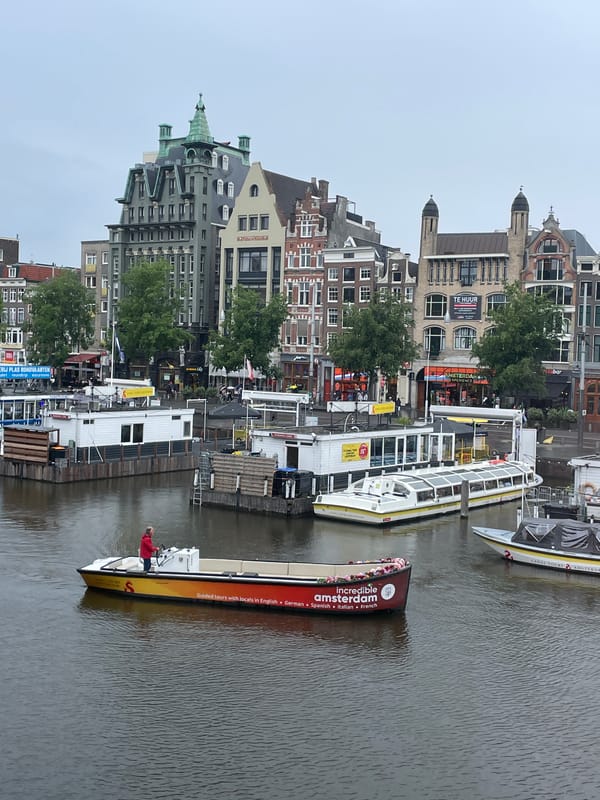 Amsterdam canal scenes documented during overcast afternoon
