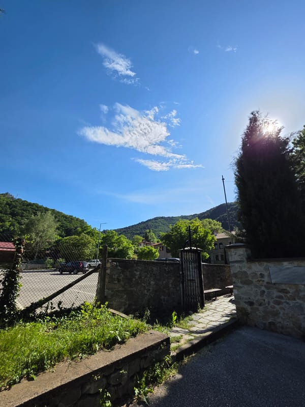 Tourist documents afternoon walk through historic Bachkovo, Bulgaria