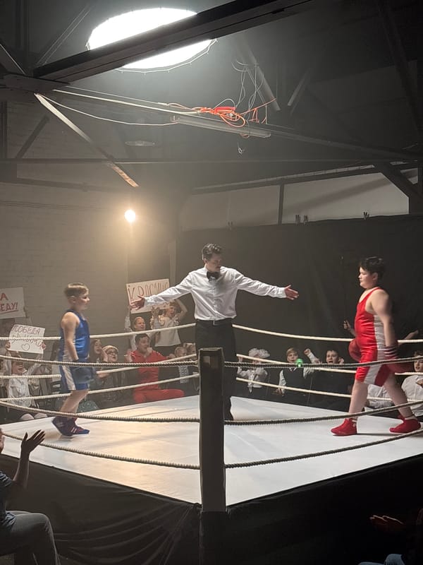 Boxing match concludes with referee declaring winner