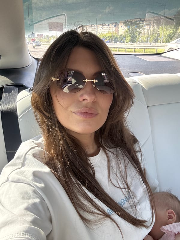 Woman and baby spotted in car during sunny day in Kyiv
