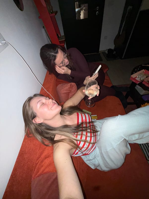 Two women enjoy wine, food, photos during Belgrade evening