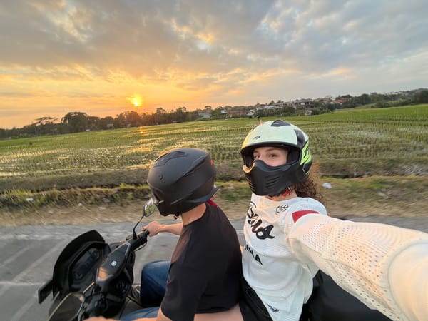 Motorcycle riders film sunset selfies in North Kuta Indonesia