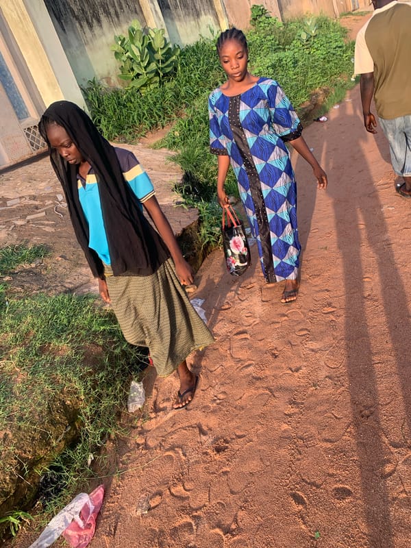 Morning street life in a Jalingo residential neighborhood