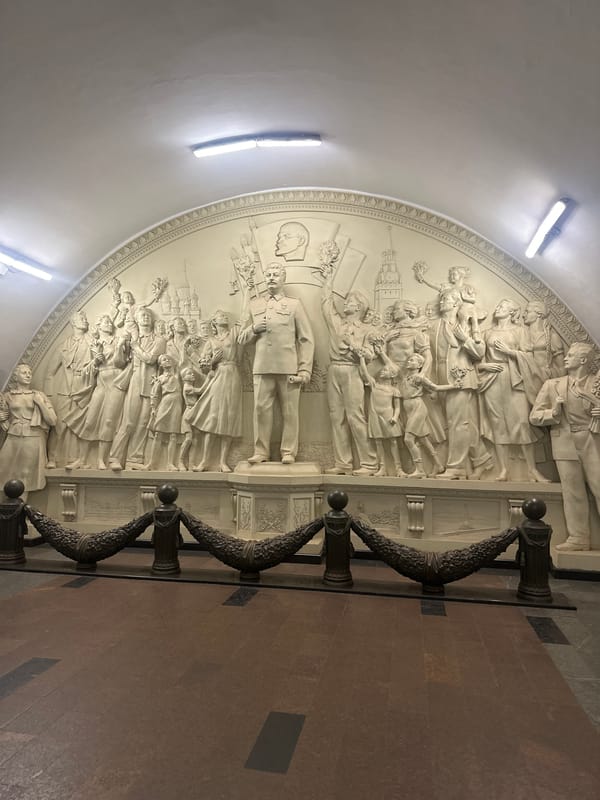 Moscow metro: ornate bas-relief and commuter rush