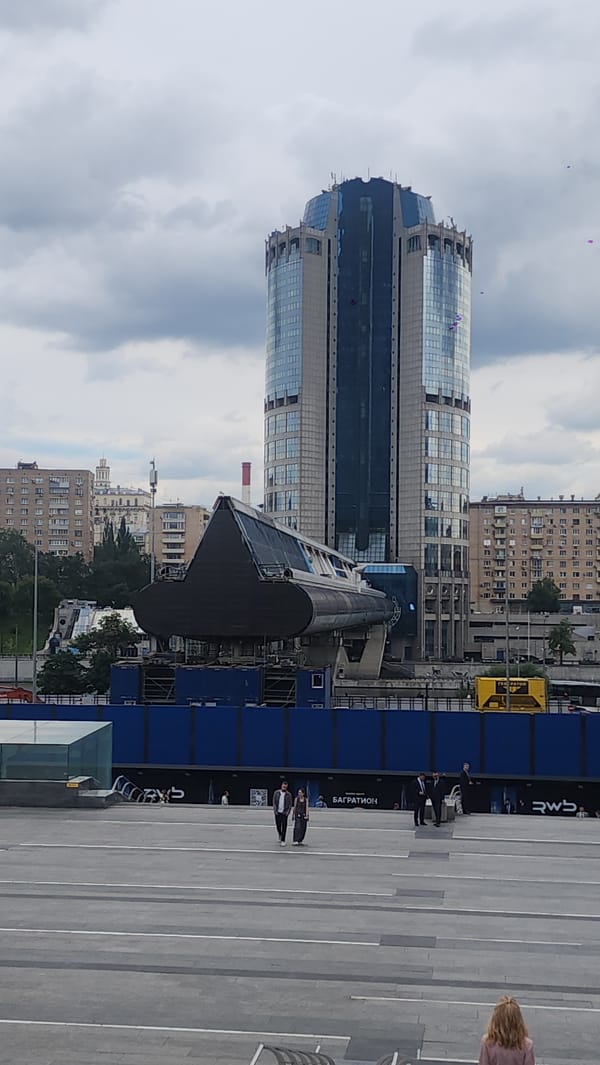 Moscow's glass towers from street level on a grey afternoon