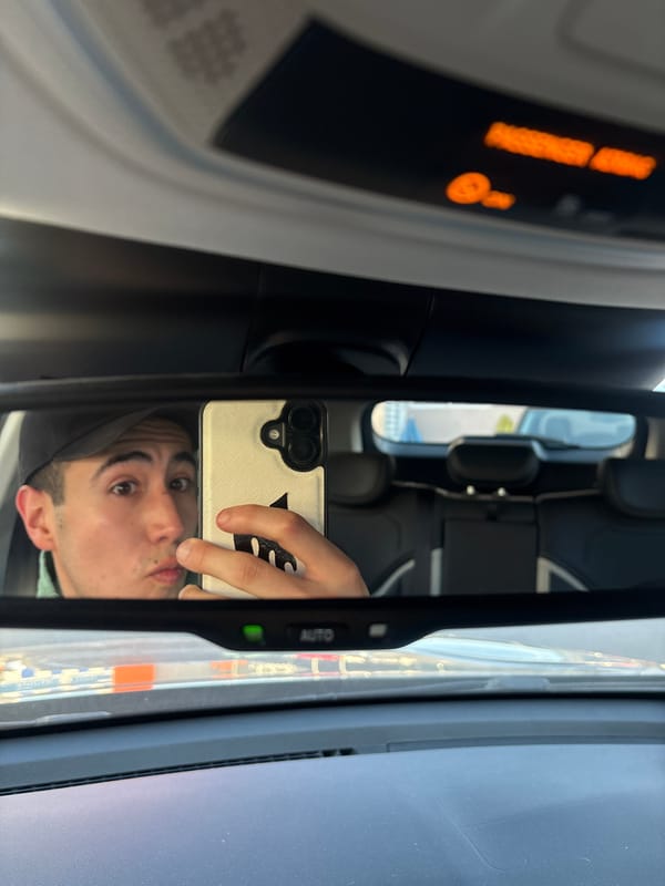 Young man observed in car mirror, Mexico