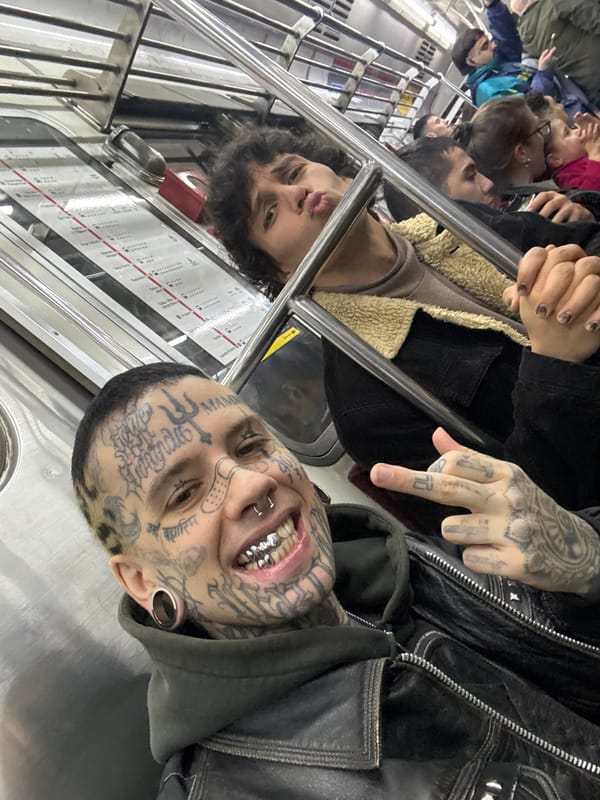 Tattooed passenger with silver grill spotted on Buenos Aires subway