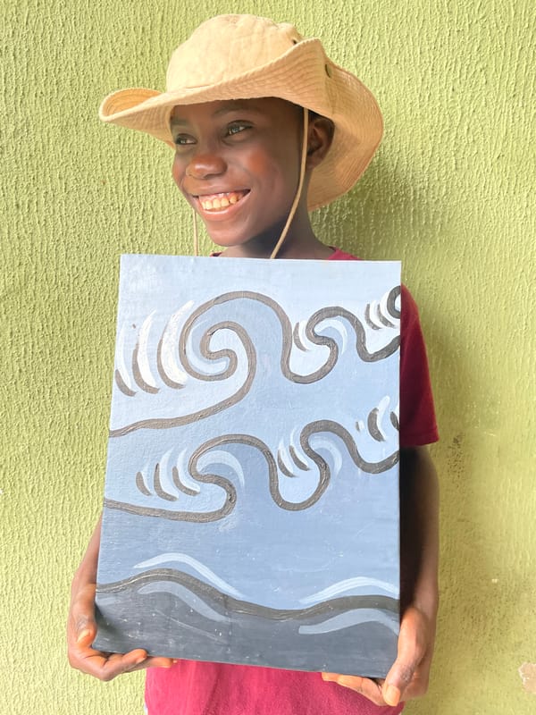 Young artist displays wave paintings on Ado street