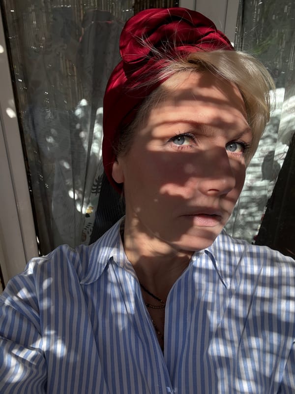 Woman rests outdoors on Rome deck during afternoon