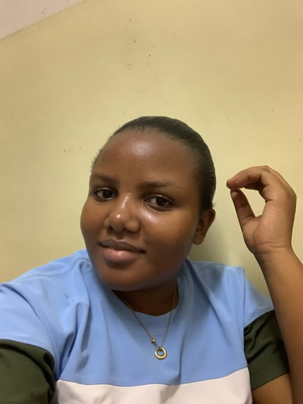 Woman poses for photos in Dar es Salaam residence