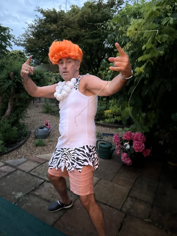 Fred Flintstone costume steals the show at a backyard party