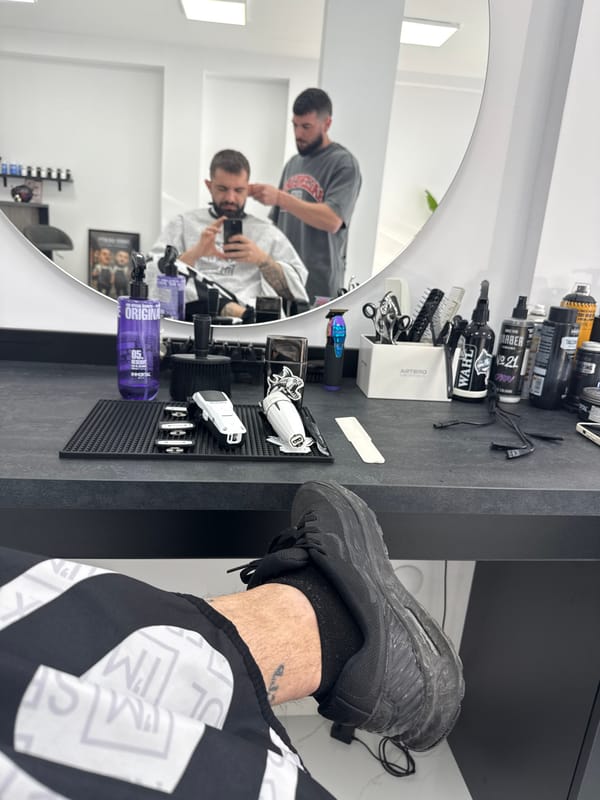 Customer takes selfie during haircut at Bulgarian barbershop