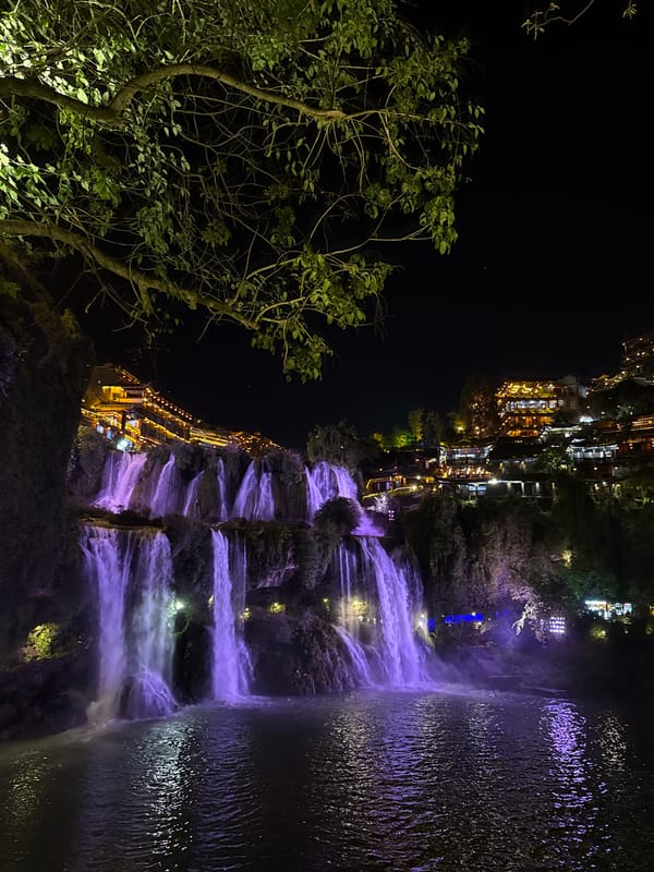 Illuminated waterfalls photographed at night in Furong, China