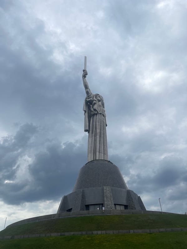 Kyiv's Motherland Monument observed under overcast skies