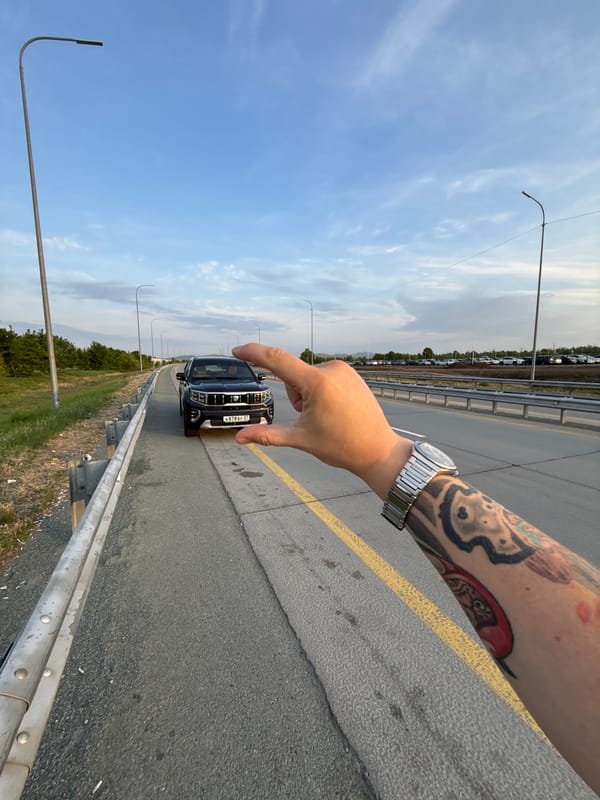 Black SUV photographed on highway in Artyom, Russia