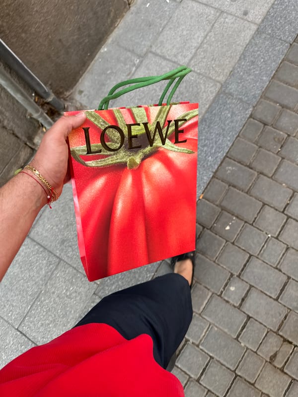 Shopper carries designer tomato-print bag through Madrid streets