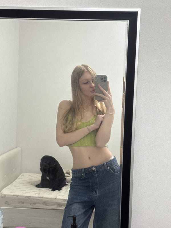 Mirror selfies and pet cuddles from a Perm apartment