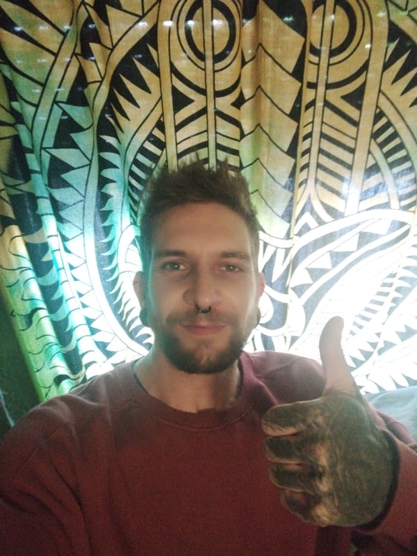Man takes thumbs-up selfie in Rubí, Spain