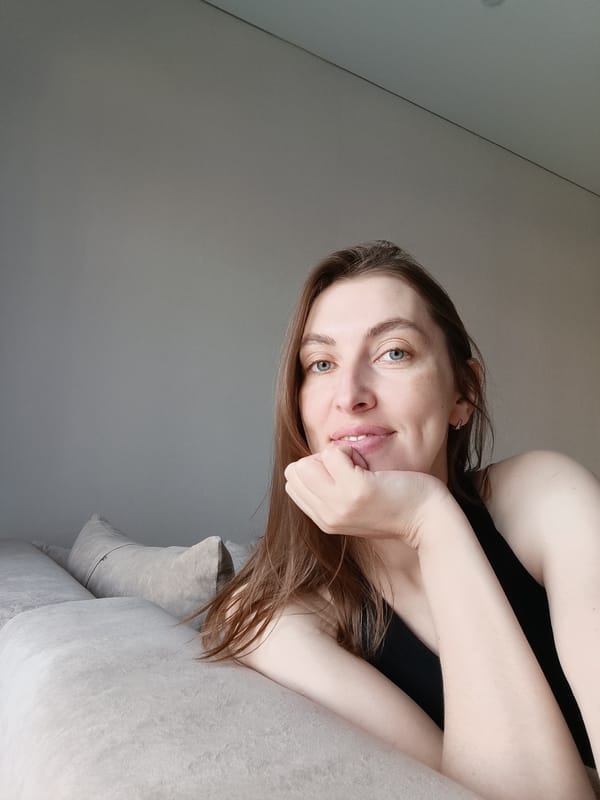 Woman observed in casual indoor setting in Chaikovsky, Russia