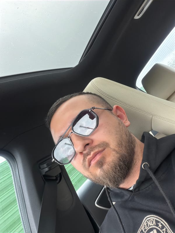 Man in Fendi hoodie spotted in car during rain