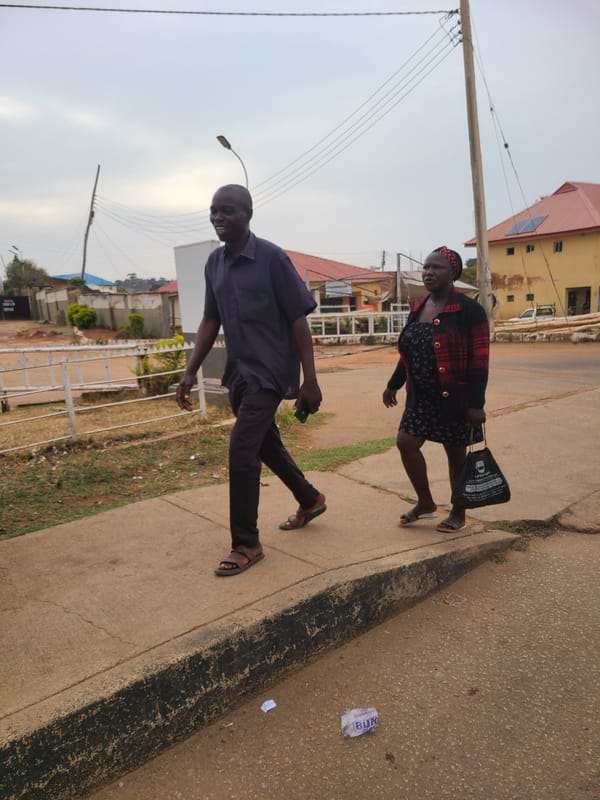 Pedestrians captured on Jos streets during afternoon hours