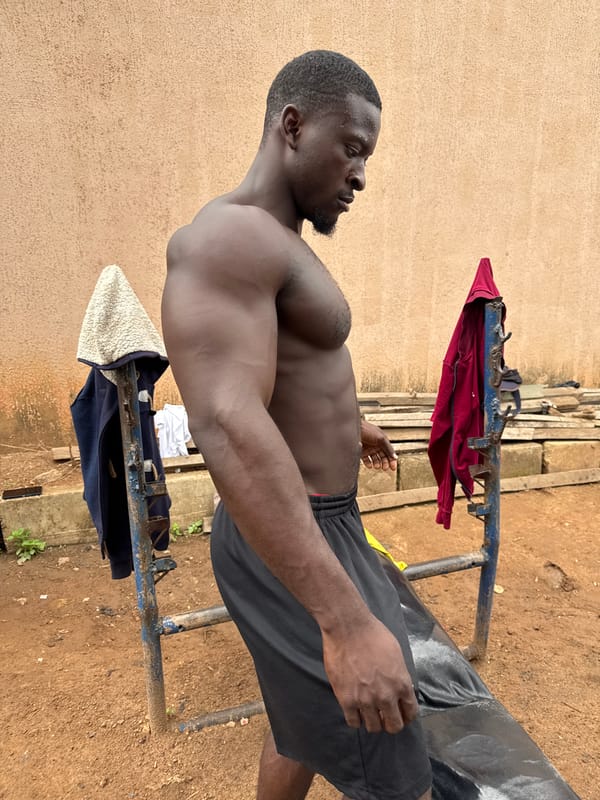 Community fitness group exercises with improvised weights in Akwanga