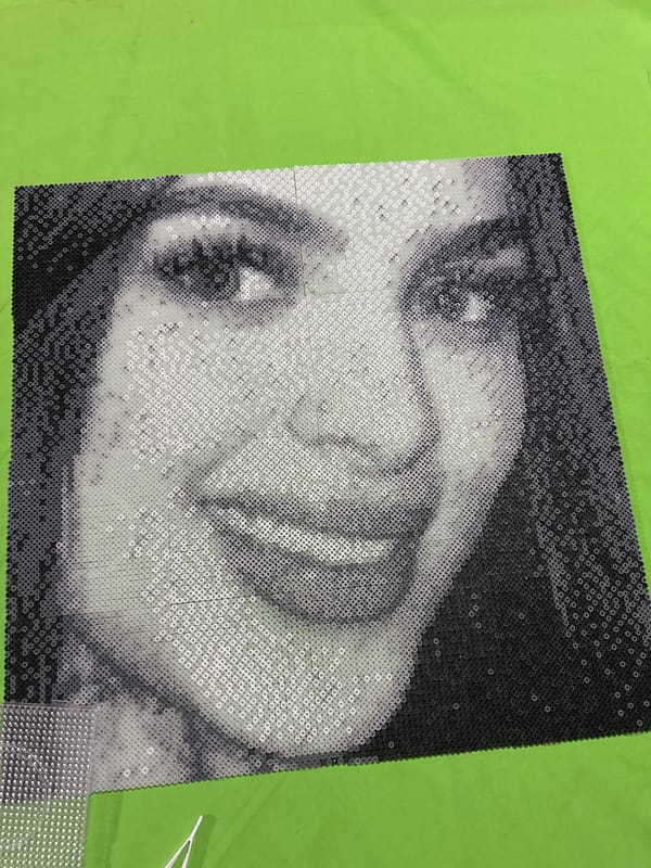 Sequined portrait artwork documented in Puebla, Mexico