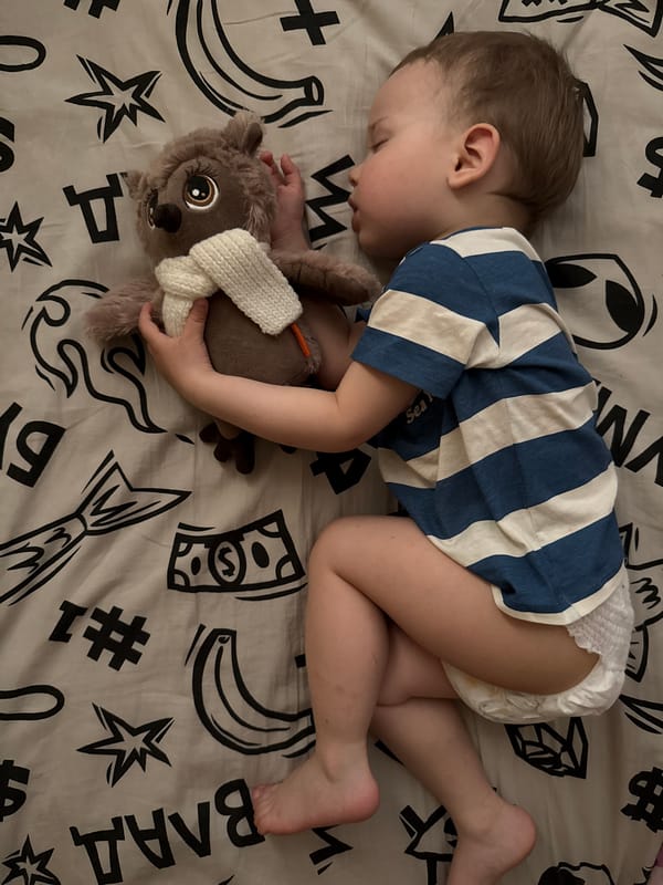 Quiet morning moments: sleeping child and woman documented