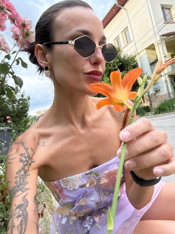 Woman in purple dress photographed with flowers in Pleven