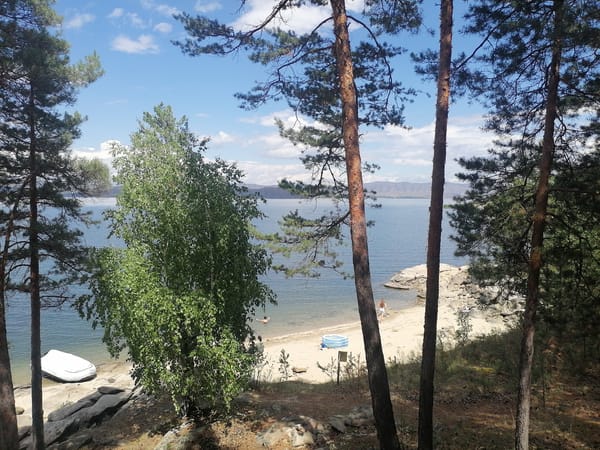 Kayaks and calm water at a Kazakhstan lakeside