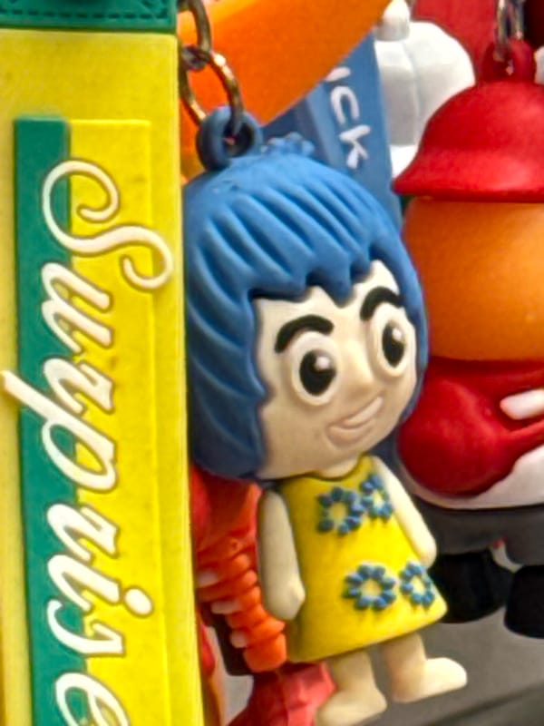 Browsing plush toys and novelty items at a Keila shop