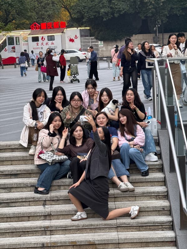 Young women pose for group photos on Yuzhong District steps