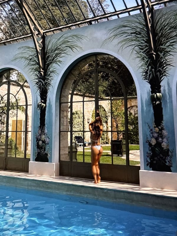 Woman poses by indoor pool in Yerevan