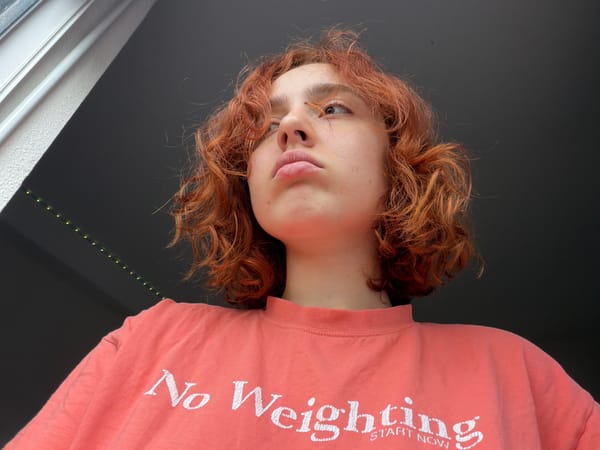 Person with red hair photographed from multiple angles in Strasbourg