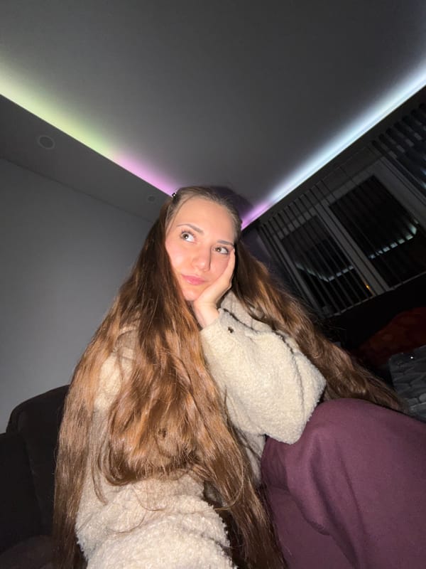 Woman takes selfies during brief photo session in Bulgarian home