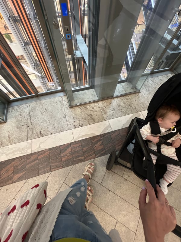 Inside a Russian shopping mall, stroller in tow