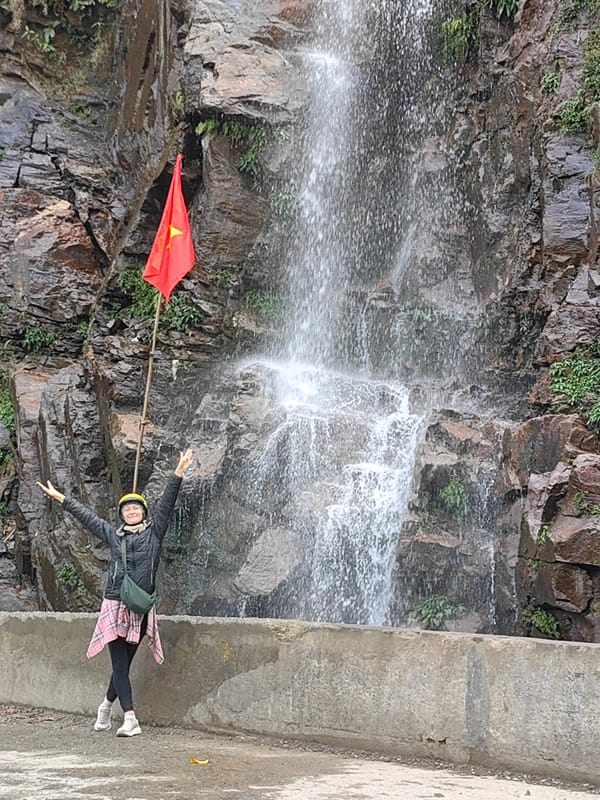 Tourists Visit Waterfall in Northern Vietnam Commune