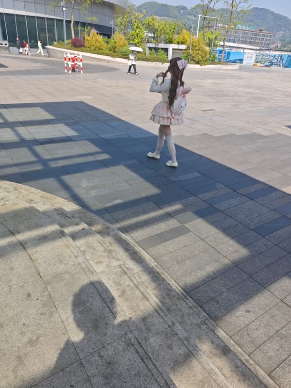 Woman in Lolita fashion walks plaza in Shapingba District