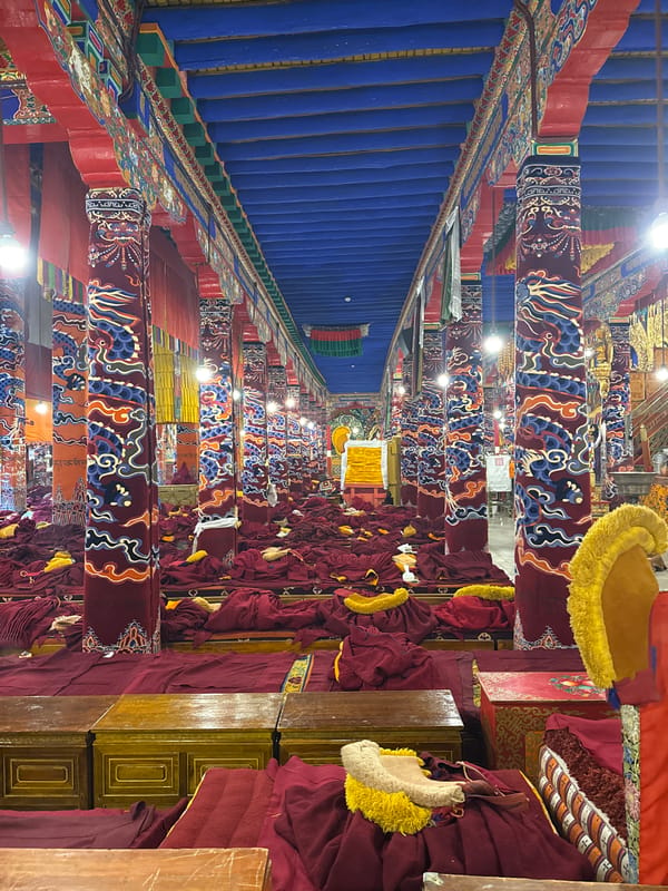 Monks gather for ceremony in Lhasa monastery hall