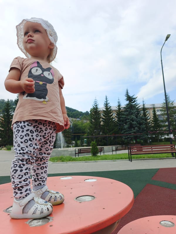 Summer morning at Zlatoust's public plaza, fountains and play structures
