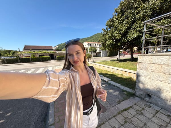 Woman takes outdoor selfie in Budva, Montenegro